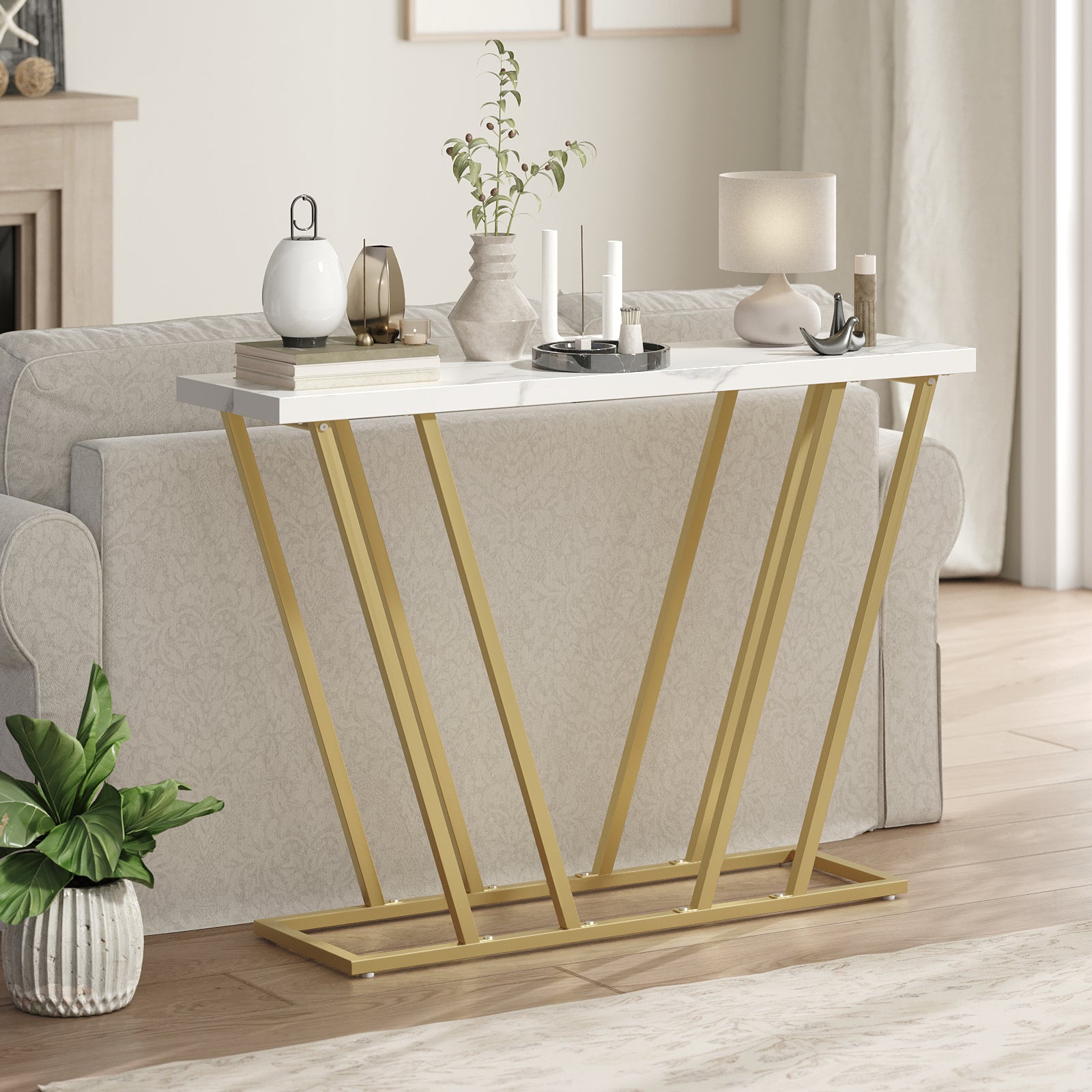 marble top console table behind the sofa