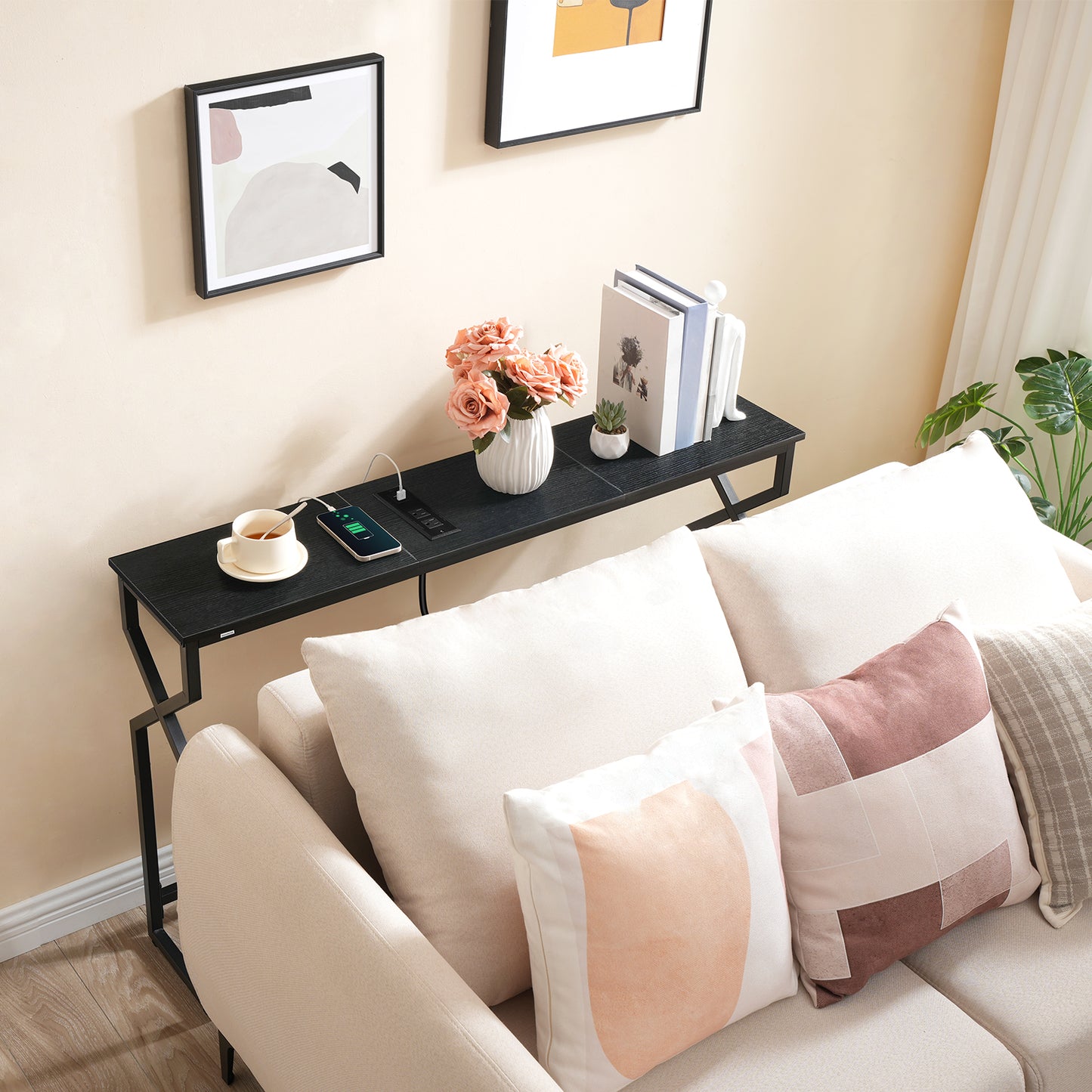 behind couch black console table with outlet