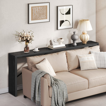 wooden console table behind the couch