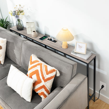 slim wooden console table behind couch