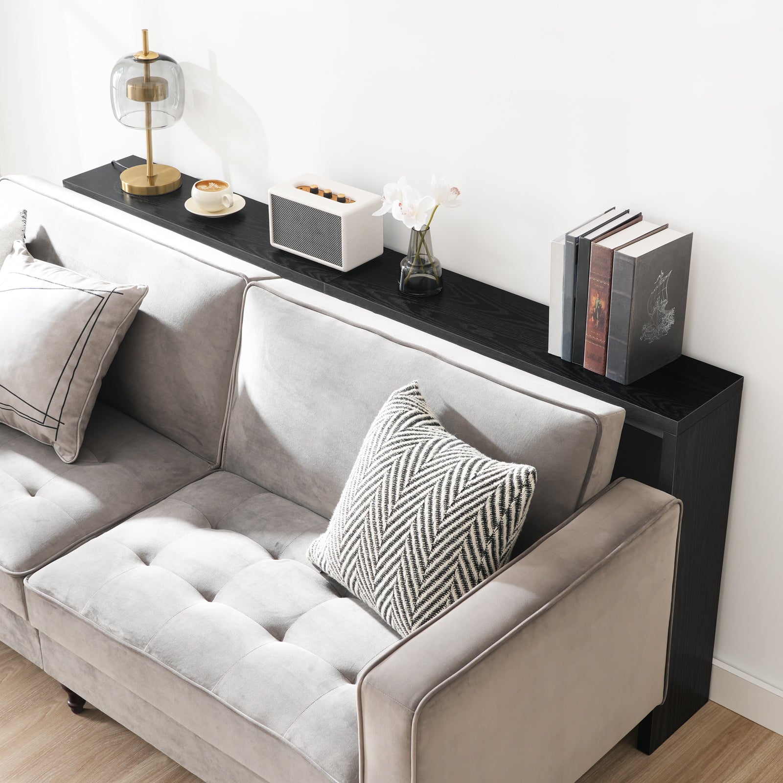 mahancris black wooden console table behind the sofa